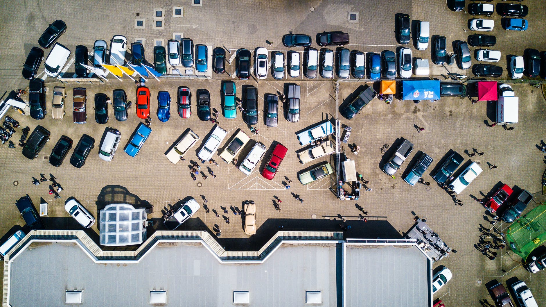 high angle photo of vehicles parked near building